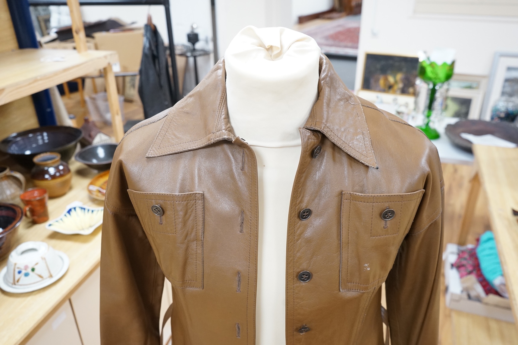 A Baccarat tan leather jacket and a black close-fitting Korean leather jacket size 10